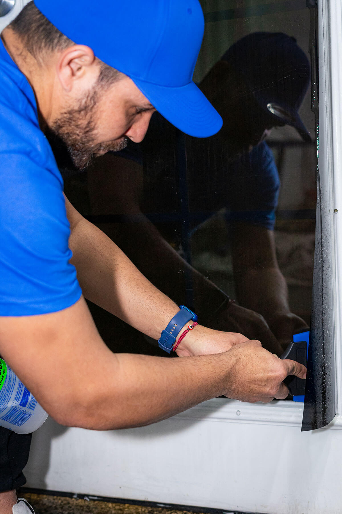 Sacrificial anti-graffiti commercial window film installed on a Summerlin alley-facing storefront to take tagging and acid etch